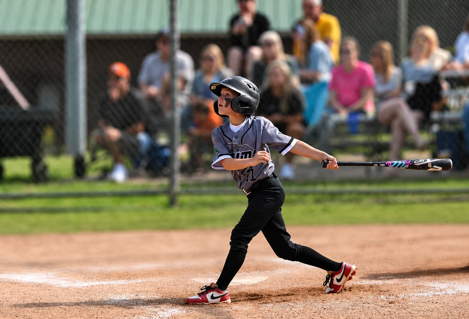 5G Prime batter following through on a swing