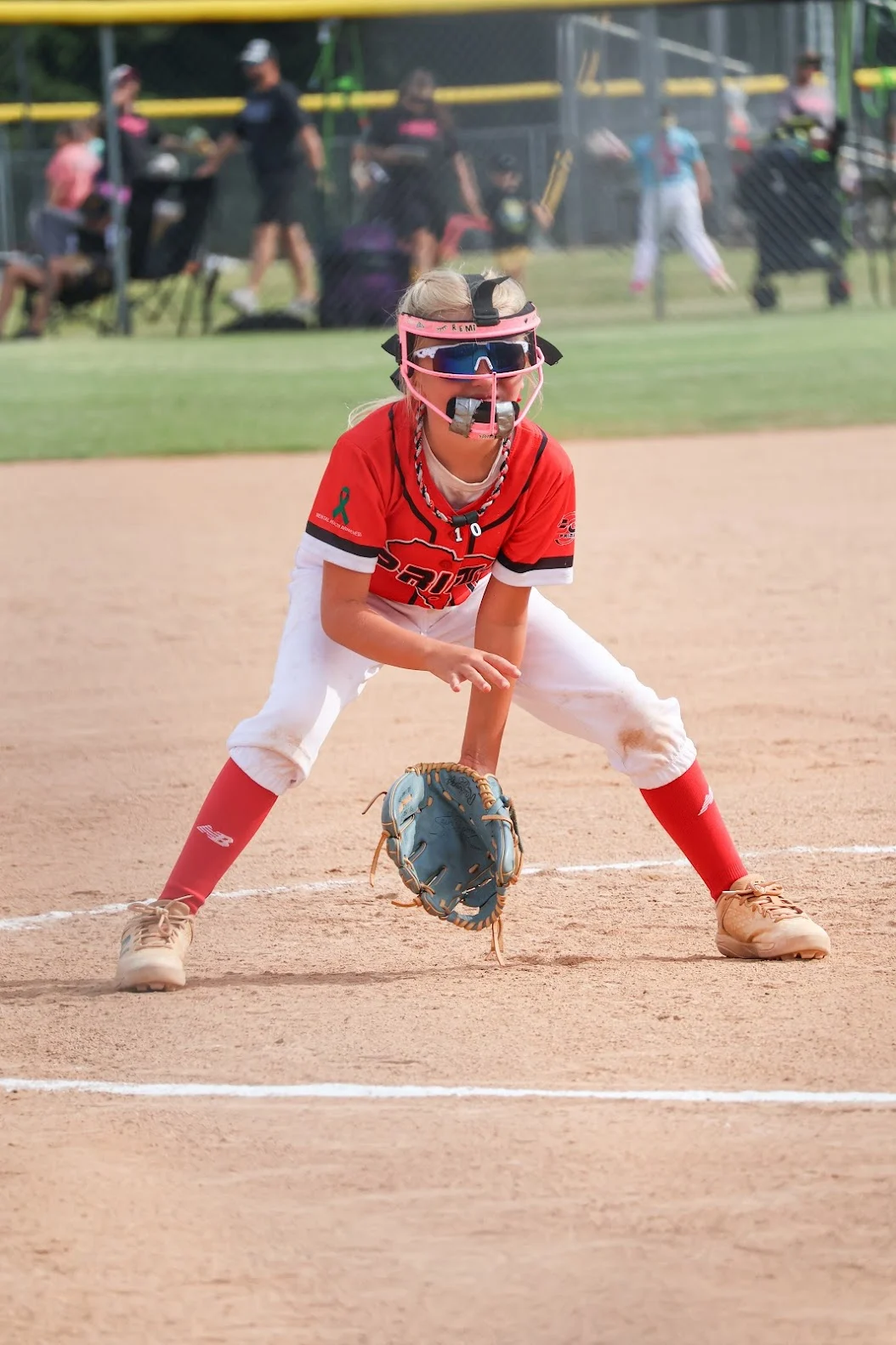 5G Prime softball player wearing the mental health awareness ribbon