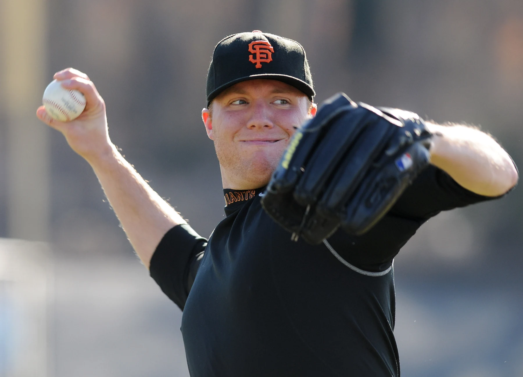 Kevin Pucetas delivering a pitch in his Giants uniform