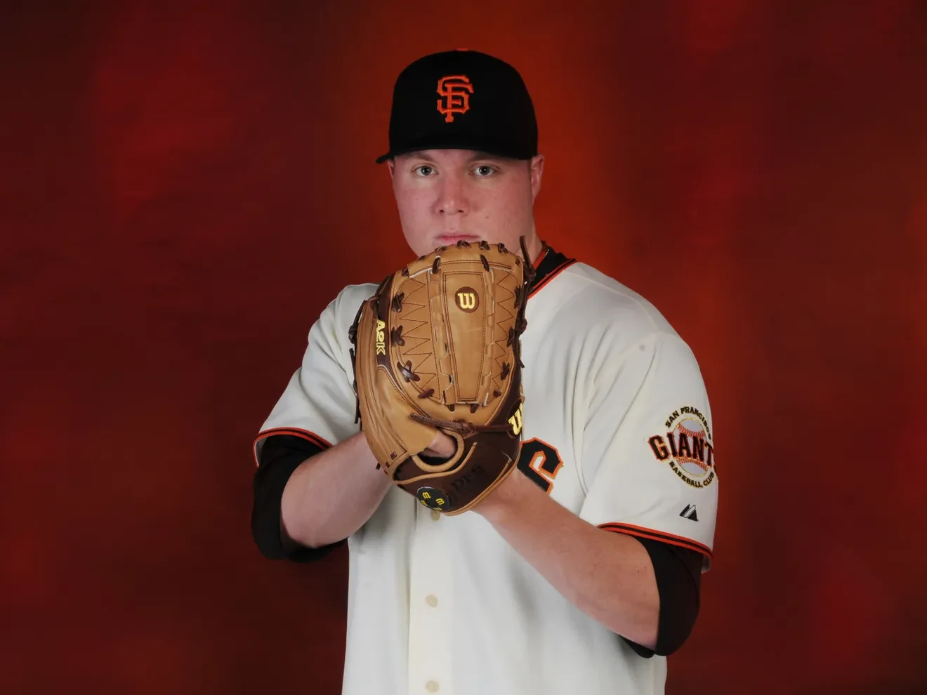 Kevin Pucetas in his San Francisco Giants uniform, holding his glove for a portrait